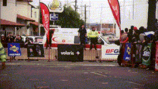 a sign that says volaris on it in front of a fence