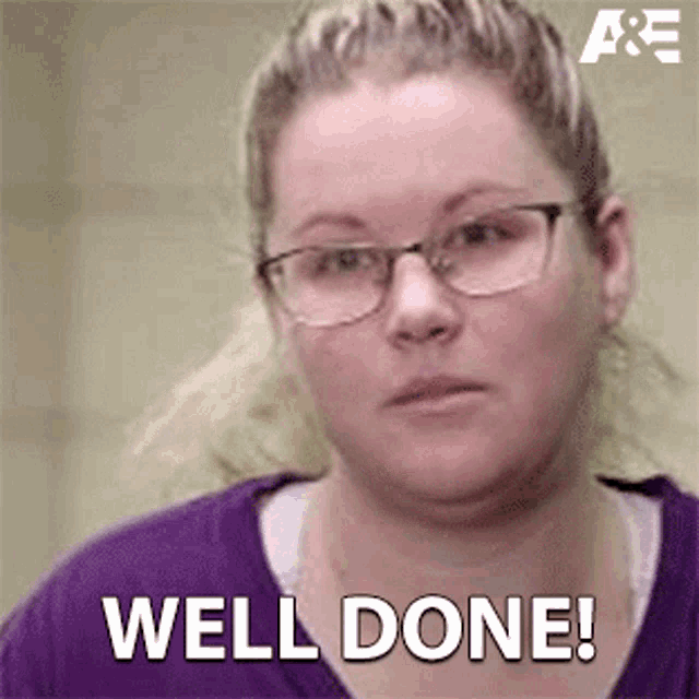 a woman wearing glasses is making a face and saying `` well done '' .