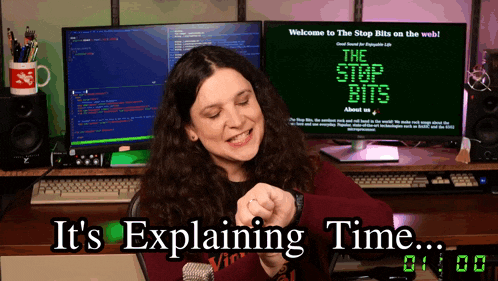 a woman is sitting in front of a computer screen that says " welcome to the stop bits on the web "