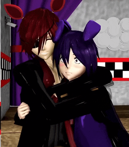 a man and a woman are hugging each other in a room .