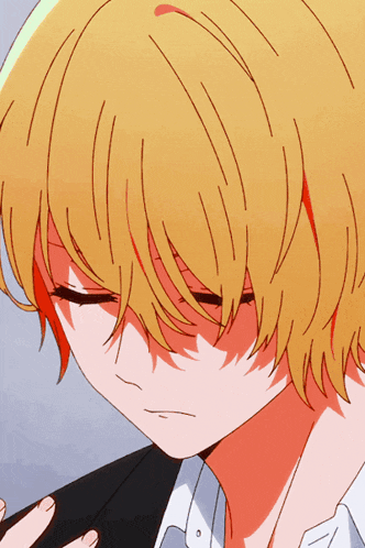a close up of a person with yellow hair and red highlights