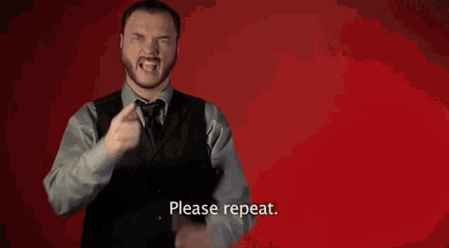 a man in a suit and tie is saying please repeat .