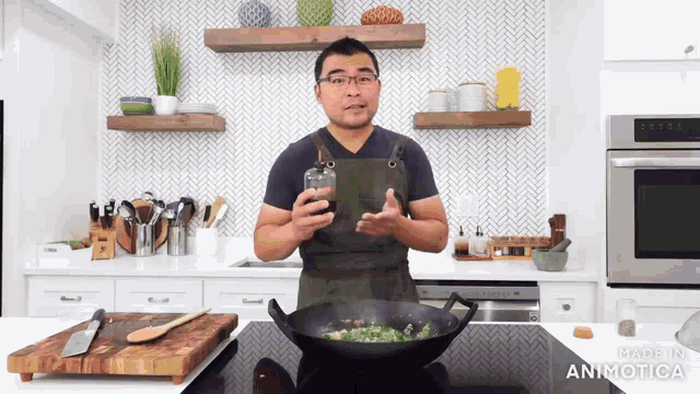a man in an apron is cooking in a kitchen with the words made in animatica at the bottom of the screen