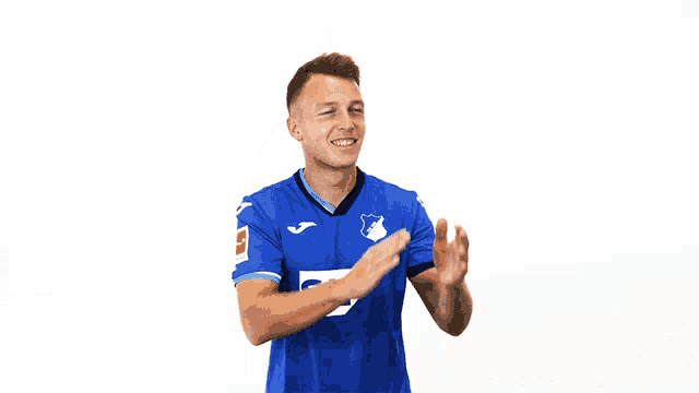 a man wearing a blue shirt with sap on it