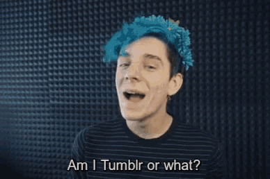 a young man with blue hair is making a peace sign with the words am i tumblr or what