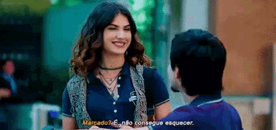 a man and a woman are talking to each other .