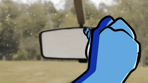 a cartoon of a fist in front of a car rear view mirror