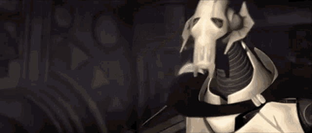 a skeleton is holding a sword in his mouth in a dark room .