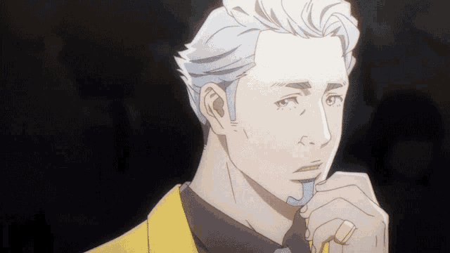 a close up of a man 's face with a yellow jacket