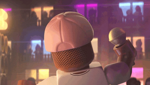 a lego man is singing into a microphone