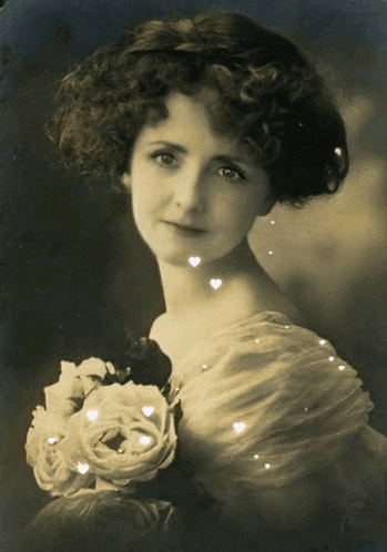 a black and white photo of a woman holding a bouquet of flowers