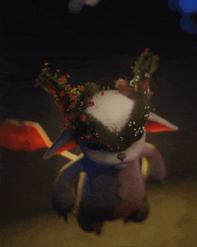 a stuffed animal with a wreath of flowers on its horns