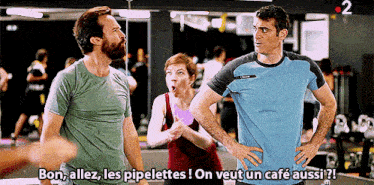 a man and a woman are standing in a gym with the words bon allez les pipelettes on veut un cafe aussi