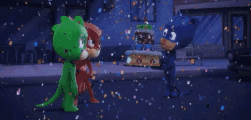 a cat and owl are standing in front of a cake that says ' pj masks ' on it