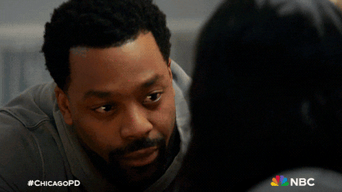 a man kissing a woman on the cheek with a chicagopd logo in the background