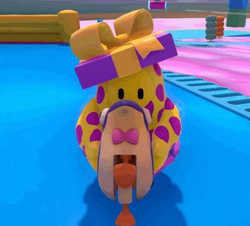 a giraffe with a purple bow on its head