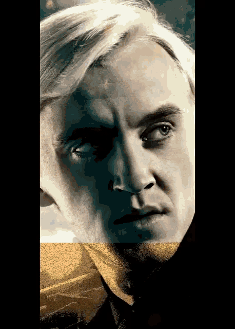 a close up of a man 's face with a yellow border