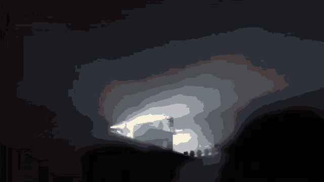 a dark room with a lot of candles lit up