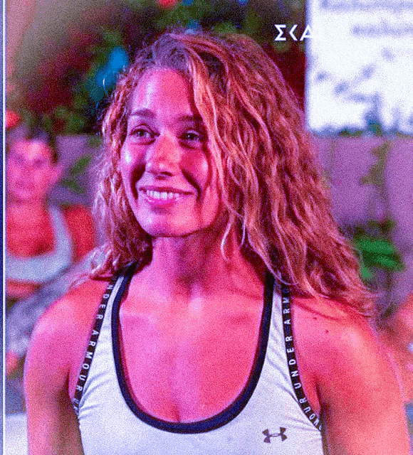 a woman wearing a tank top that says under armour