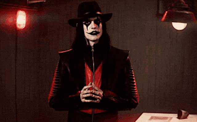 a man in a black and red outfit with the word freedom on the bottom right