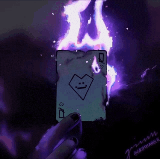a person holding a burning queen of hearts card