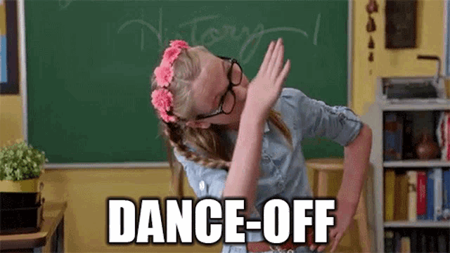 a girl wearing glasses and a flower crown is doing a dab in front of a chalkboard .