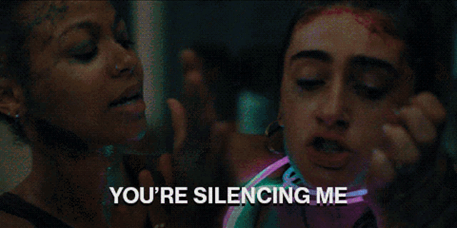 a woman is wearing glow in the dark necklaces and bracelets and the words you 're silencing me are above her