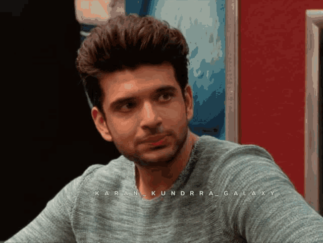 a close up of a man 's face with the name karan kundra galaxy on the bottom right