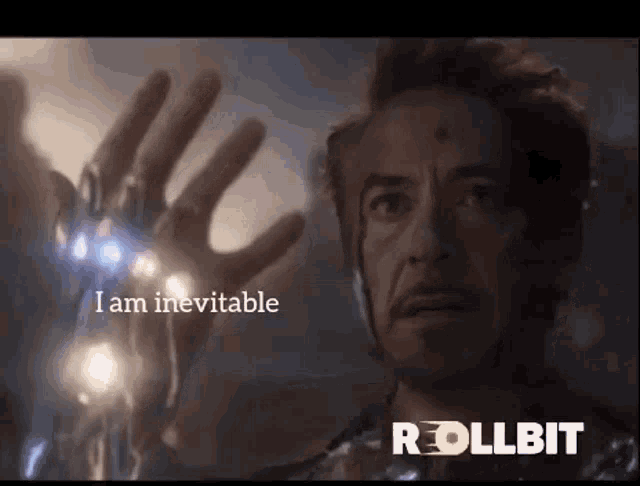 a close up of a man 's hand with the words `` i am inevitable '' written above it .