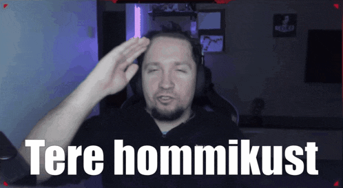 a man salutes in front of a screen that says tere hommikulst
