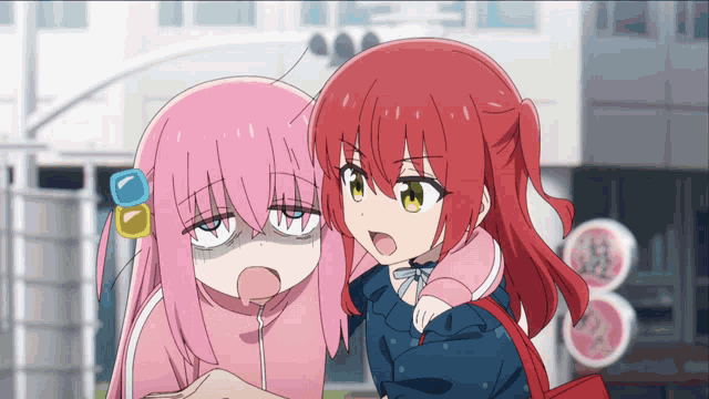 a girl with pink hair and a red haired girl with yellow eyes