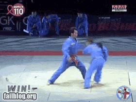 a judo match is being shown on failblog.org with the number 110 on the screen