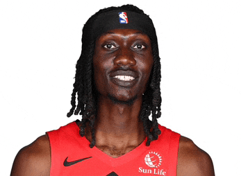 a man with dreadlocks wearing a headband with the nba logo on it
