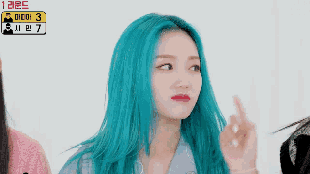 a girl with blue hair has a sign that says 3 and 7 on it