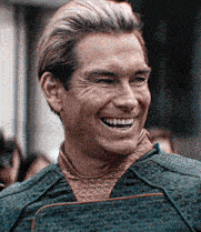 a close up of a man 's face with a slight smile on his face .