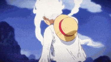 a person wearing a straw hat with a red and white stripe on it