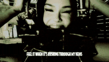 a black and white photo of a woman with the words feel it when it 's rushing through my veins on the bottom