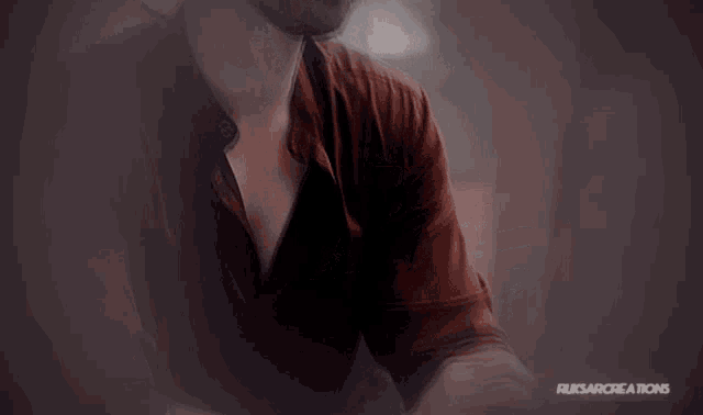 a person holding another person 's hand with ruksarcreations written on the bottom right