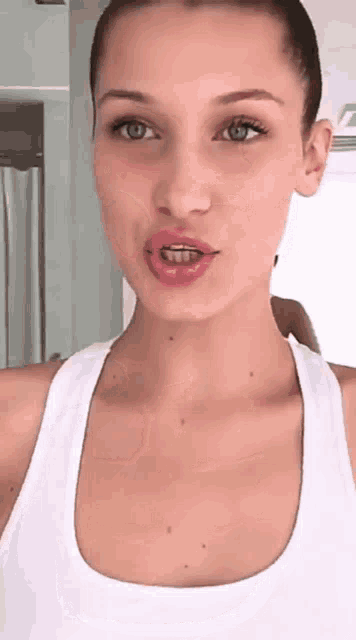 a woman with braces on her teeth is taking a selfie