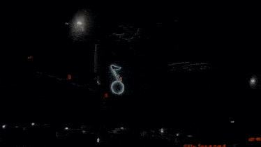 a group of people are dancing in front of a house at night