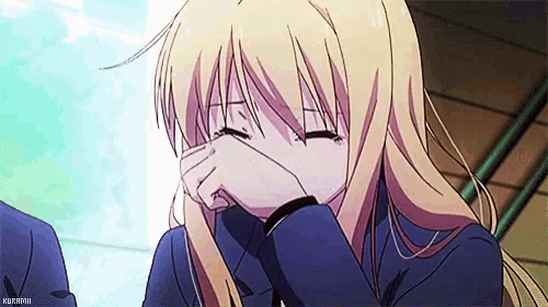 a blonde anime girl with long hair is covering her face with her hands .