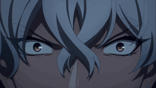 a close up of a person 's face with a very angry look on their face