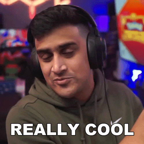 a man wearing headphones says " really cool " on the screen