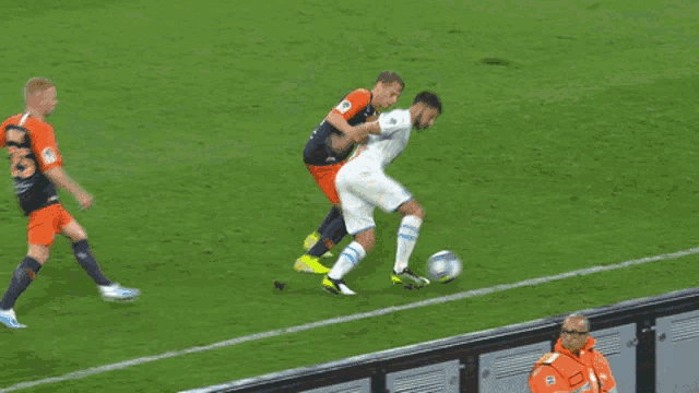 a soccer player with the number 8 on his jersey kicks the ball