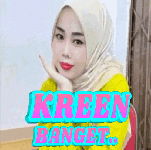 a woman wearing a hijab and a yellow shirt with the words kreen banget behind her