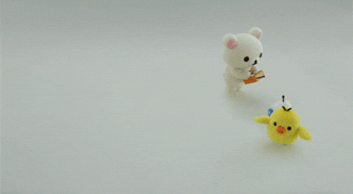 three stuffed animals are standing next to each other including a yellow chicken and a white bear