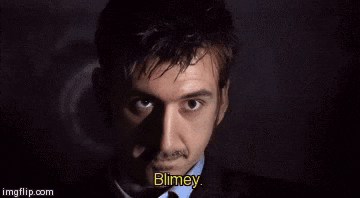 a man in a suit and tie says " blimey "