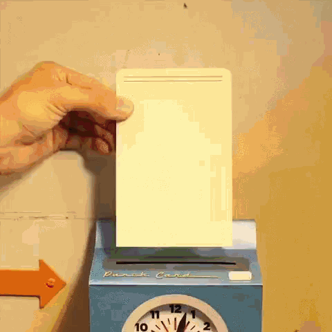 a punch card is being inserted into a punch card machine