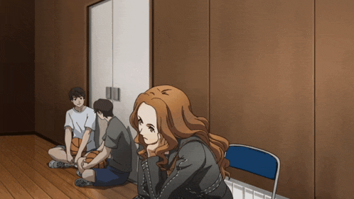 a group of people are sitting on the floor and one of them has a basketball in her hand