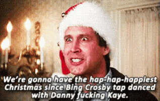 a man is wearing a santa hat and saying we 're gonna have the hap-hap-happiest christmas